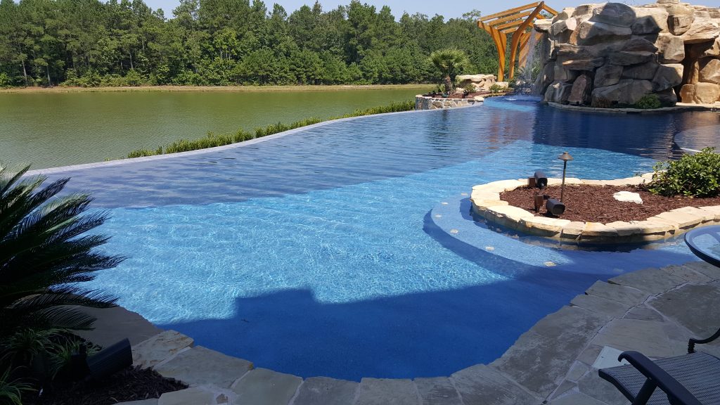 myrtle beach pool builder contractor myrtle beach swimming pool spa travertine waterfall water feature fountain blue pool sun shelf custom