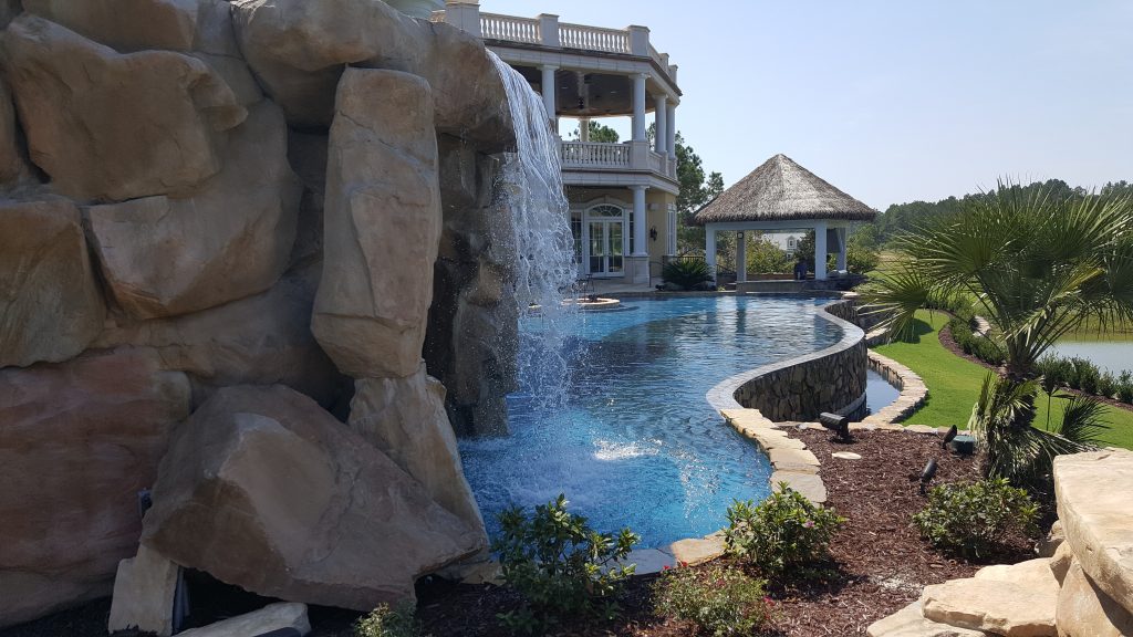 myrtle beach pool builder contractor myrtle beach swimming pool spa travertine waterfall water feature fountain blue pool sun shelf custom