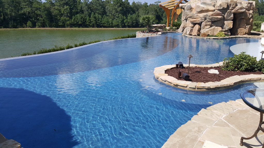 myrtle beach pool builder contractor myrtle beach swimming pool spa travertine waterfall water feature fountain blue pool sun shelf custom