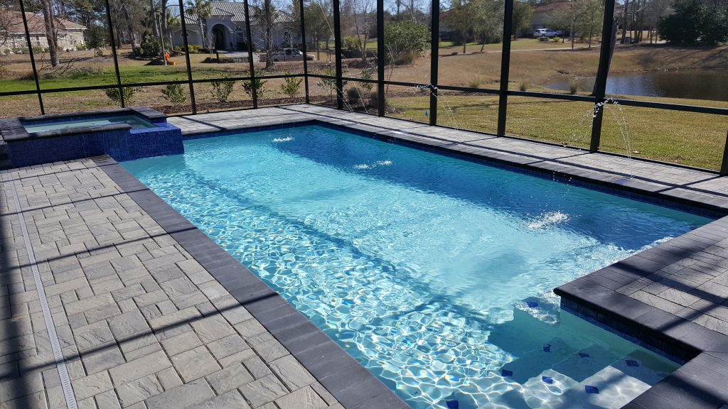 myrtle beach pool builder contractor myrtle beach swimming pool spa travertine waterfall water feature fountain blue pool sun shelf custom