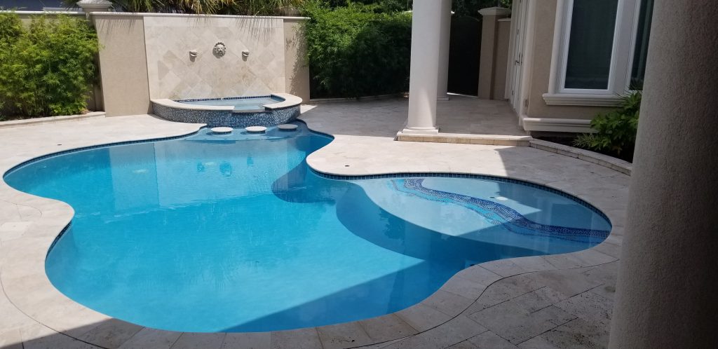 myrtle beach pool builder contractor myrtle beach swimming pool spa travertine waterfall water feature fountain blue pool sun shelf custom