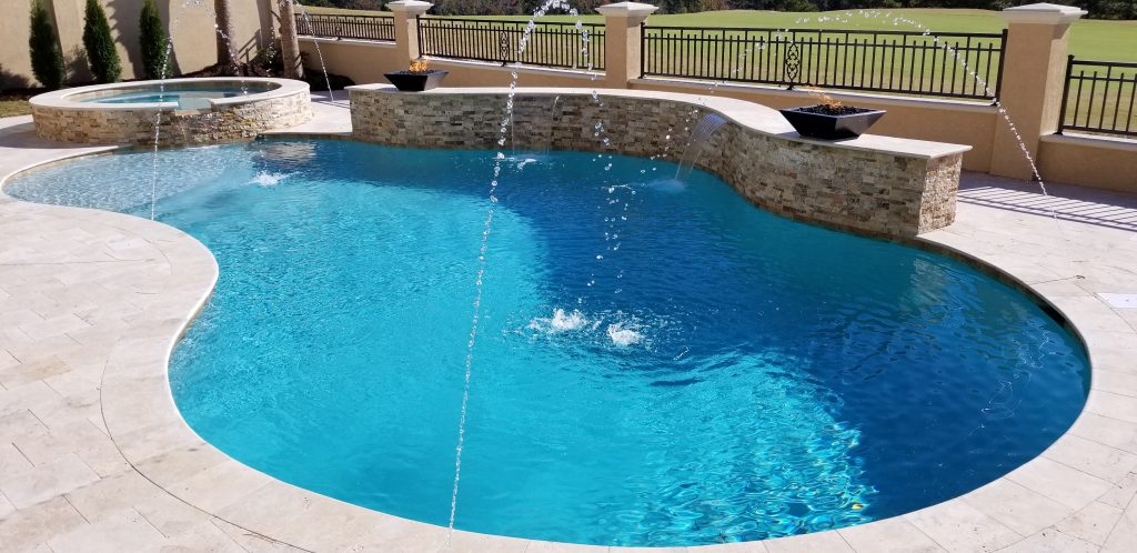 myrtle beach pool builder contractor myrtle beach swimming pool spa travertine waterfall water feature fountain blue pool sun shelf custom