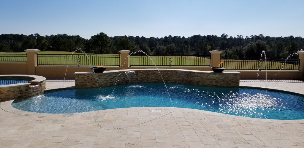 myrtle beach pool builder contractor myrtle beach swimming pool spa travertine waterfall water feature fountain blue pool sun shelf custom