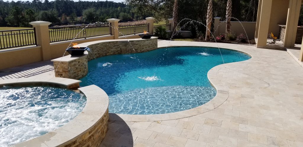 myrtle beach pool builder contractor myrtle beach swimming pool spa travertine waterfall water feature fountain blue pool sun shelf custom