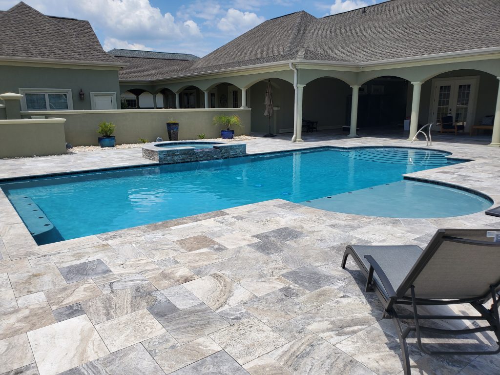 myrtle beach pool builder contractor myrtle beach swimming pool spa travertine waterfall water feature fountain blue pool sun shelf custom