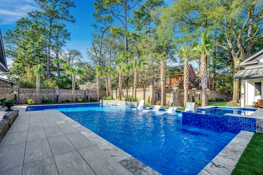 myrtle beach pool builder contractor myrtle beach swimming pool spa travertine waterfall water feature fountain blue pool sun shelf custom