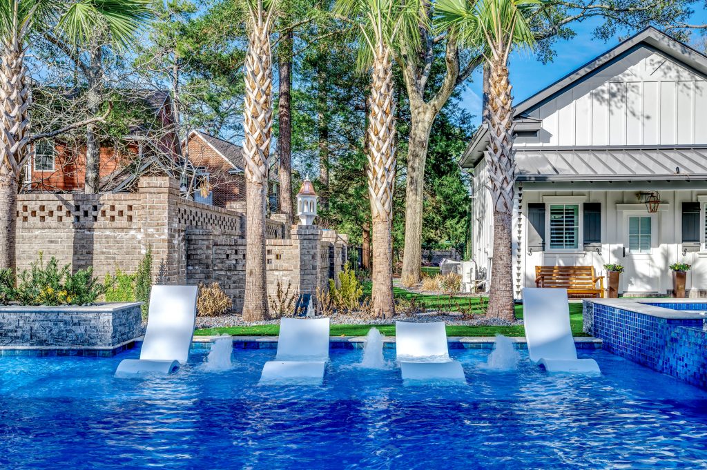 myrtle beach pool builder contractor myrtle beach swimming pool spa travertine waterfall water feature fountain blue pool sun shelf custom