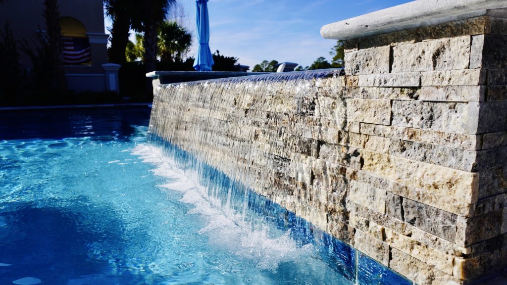 myrtle beach pool builder contractor myrtle beach swimming pool spa travertine waterfall water feature fountain blue pool sun shelf custom