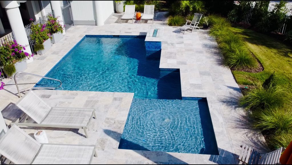 myrtle beach pool builder contractor myrtle beach swimming pool spa travertine waterfall water feature fountain blue pool sun shelf custom