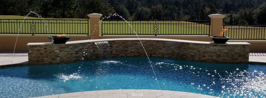 myrtle beach pool builder contractor myrtle beach swimming pool spa travertine waterfall water feature fountain blue pool sun shelf custom